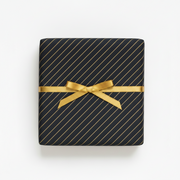 Wrapping paper, black with gold stripes. W 70 cm x 50 m