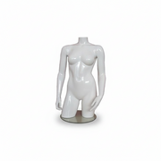 Female mannequin torso in fiberglass. White high gloss without head. Torso with hips. On a base plate.