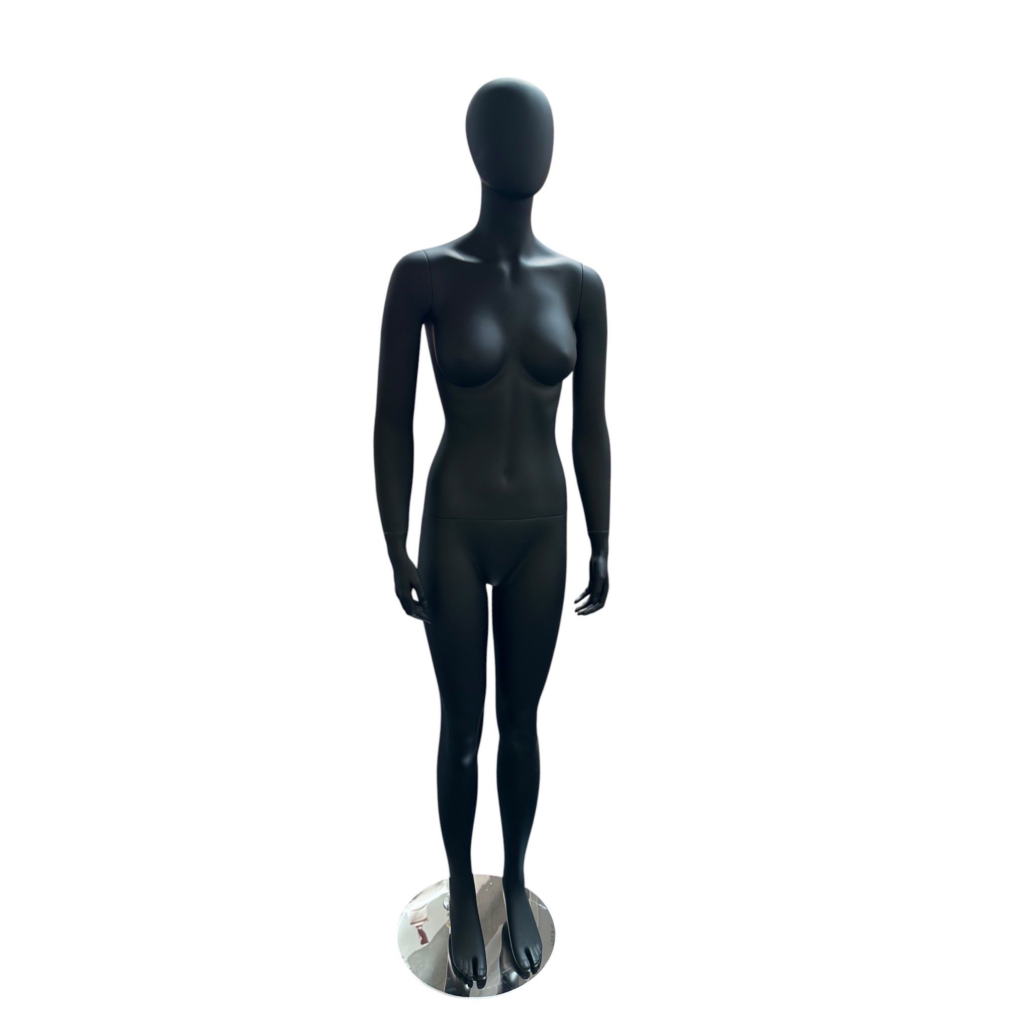 Faceless female mannequin. Black, matte with faceless head. Stands upright. Chrome base plate