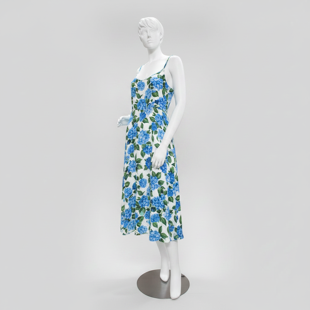 Realistic female mannequin. White with head, face and sculpted hair. Round metal base. Hand on hip