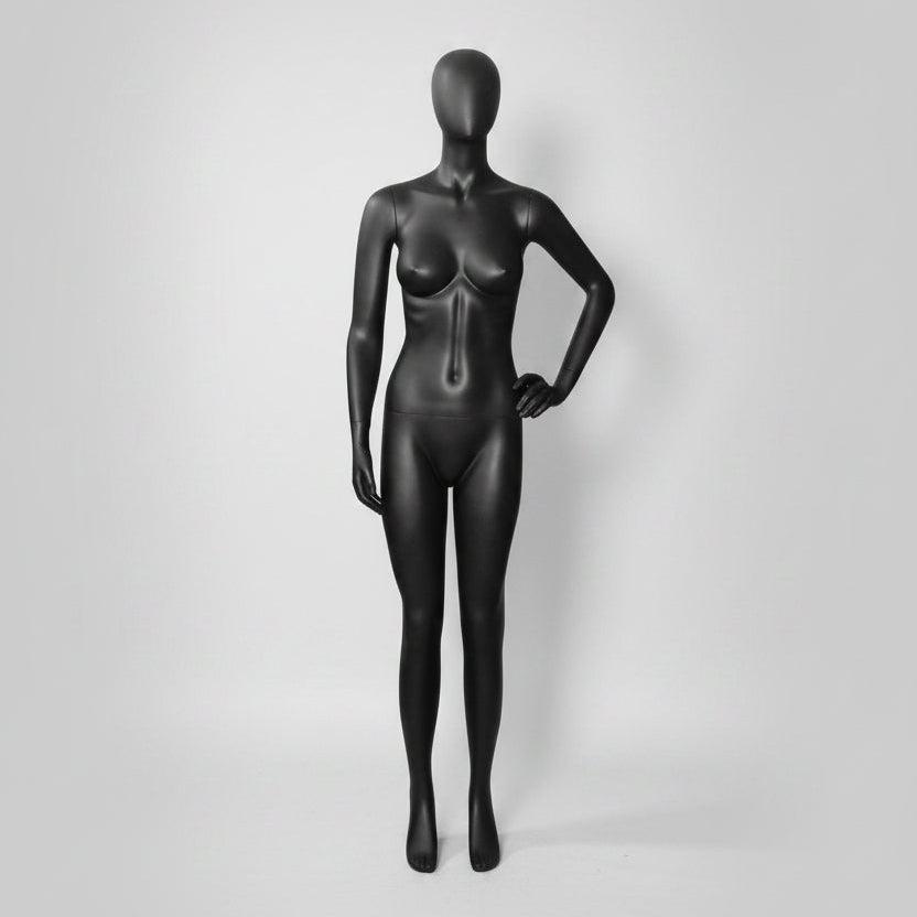 Female mannequin. Black with faceless head. Hand rests on hip. K&Q