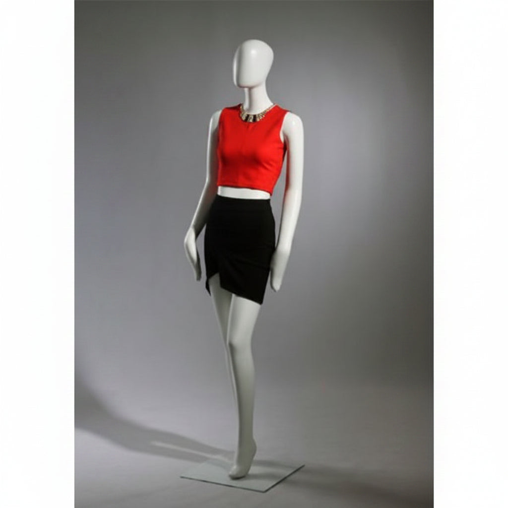 Faceless female mannequin. White, matte with faceless head. Luffed hands. Stands upright