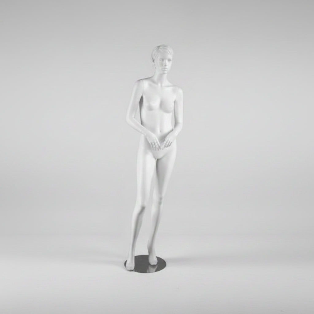 Realistic female mannequin. White with head, face and sculpted hair. Round metal base. Hand in hand