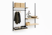 Entry wall with Framework wall rails in black, shelves and hanging rod. As shown